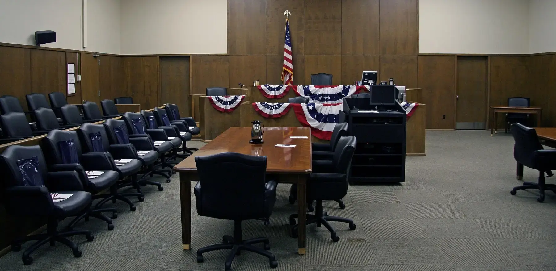 Counsel table and chairs in the well of a federal courtroom