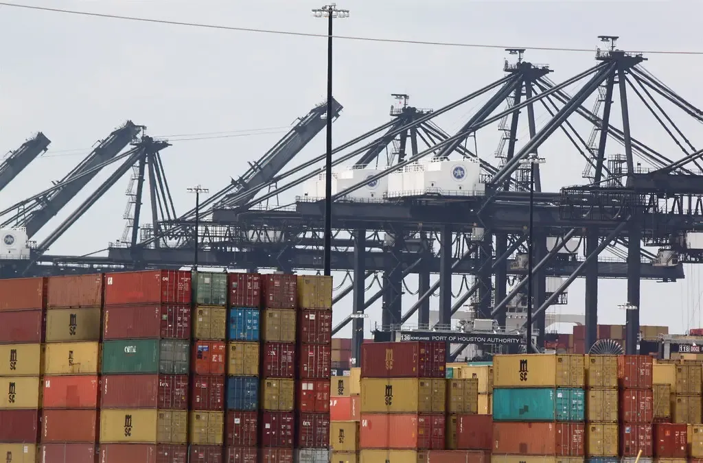 Cranes above stacked containers at a port terminal
