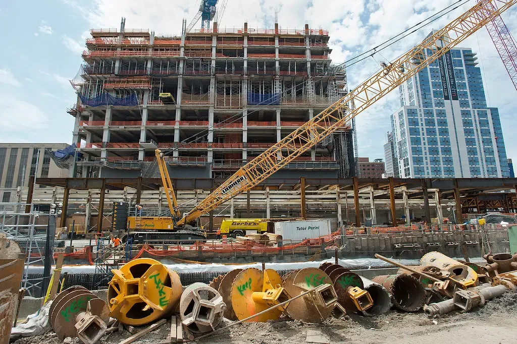 A tower crane over a building under construction