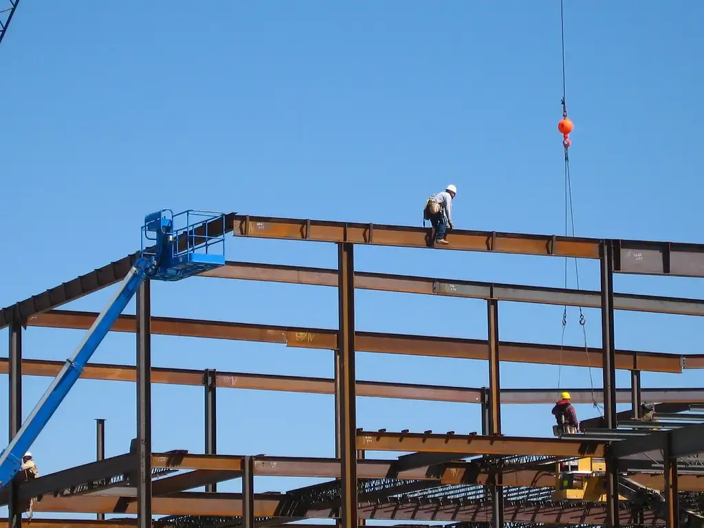 Workers on the steel frame of a building under construction
