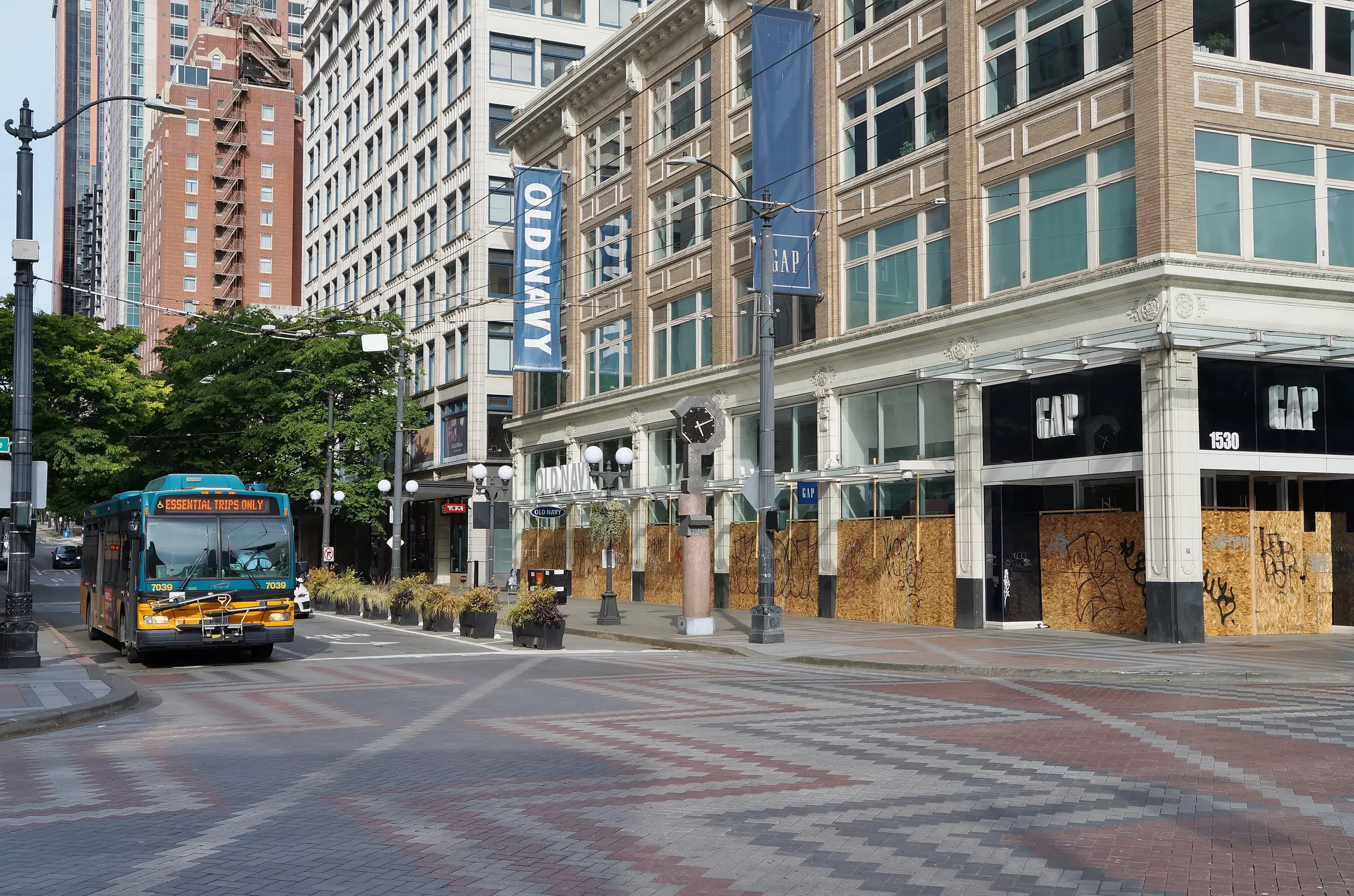 Boarded-up shopfronts along a city street